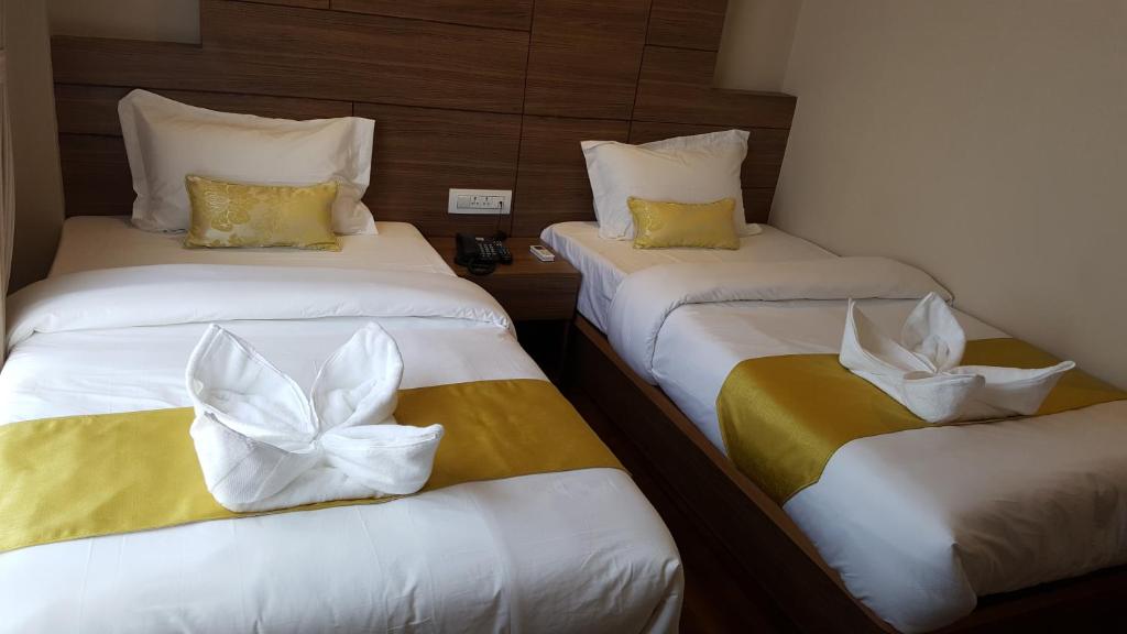 Postel nebo postele na pokoji v ubytování Hotel Bihani