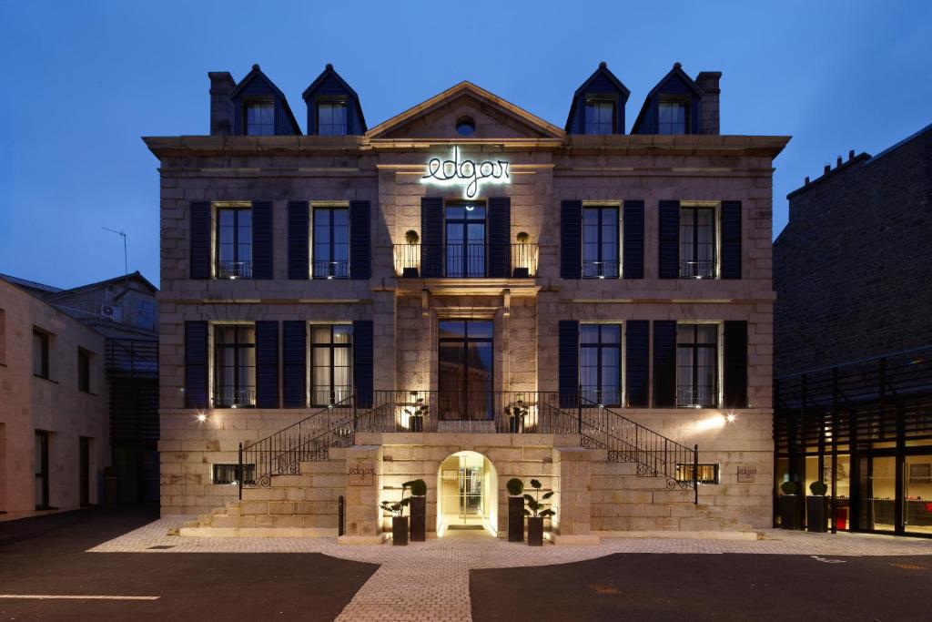 a building with a sign on the front of it at Edgar Hôtel & Spa - Table Gastronomique in Saint-Brieuc