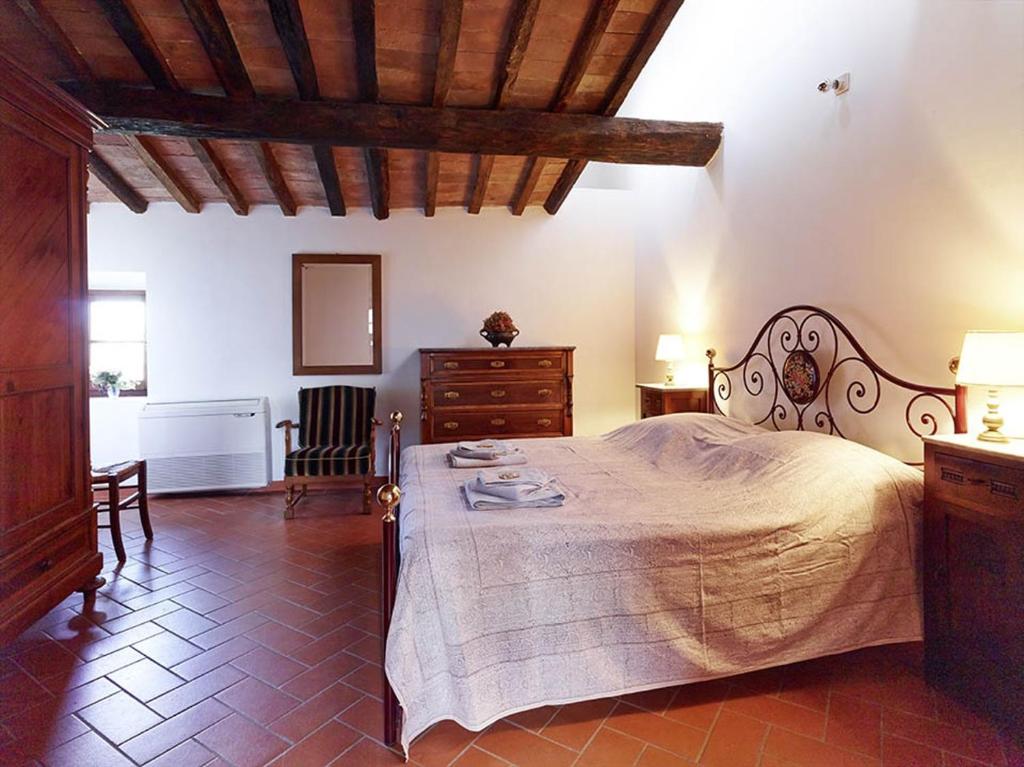 Łóżko lub łóżka w pokoju w obiekcie Agriturismo Podere Cortilla