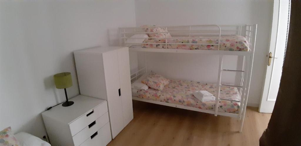 A bed or beds in a room at Piso Zona Plaza España, junto a Montjuic,