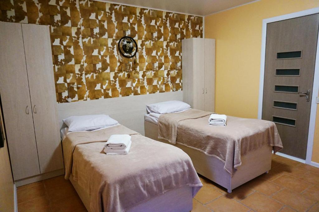 Postel nebo postele na pokoji v ubytování Kolibri