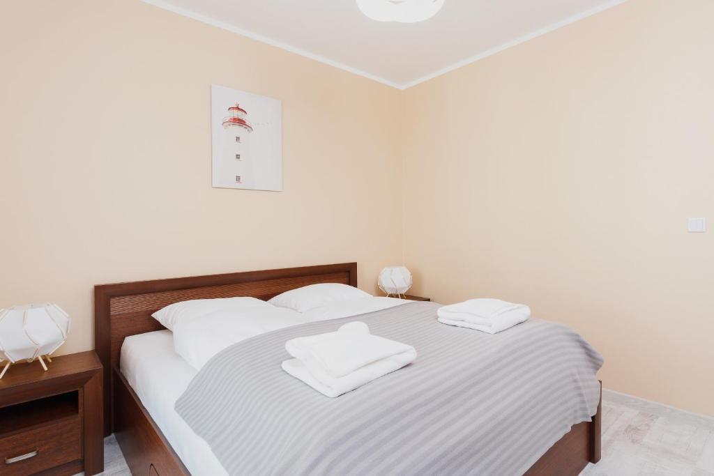 Posteľ alebo postele v izbe v ubytovaní Apartments Kraków Zablocie by Noclegi Renters