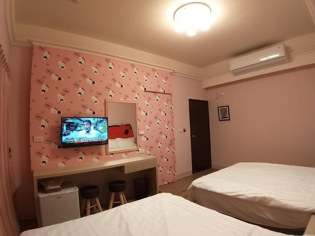 Postel nebo postele na pokoji v ubytování 200km Away From Home Homestay