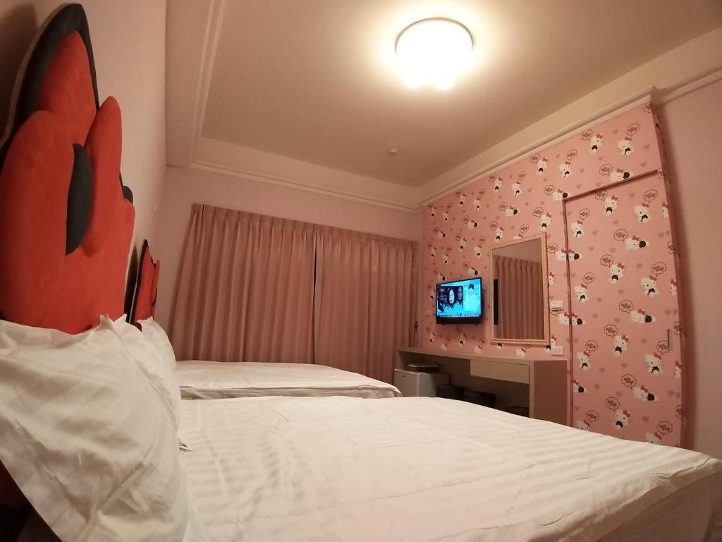 Postel nebo postele na pokoji v ubytování 200km Away From Home Homestay