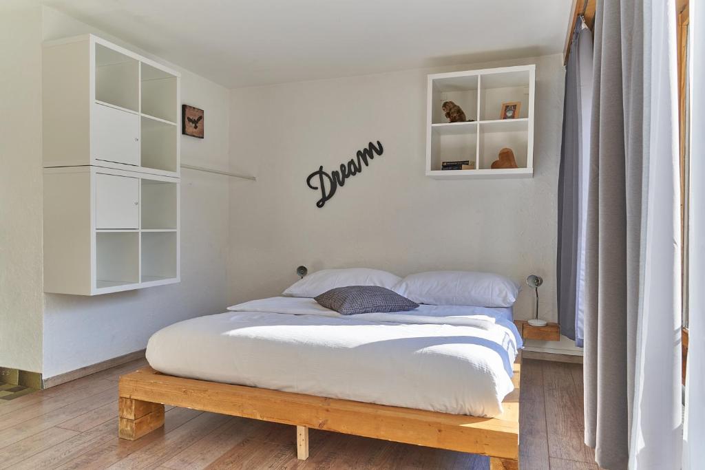 Postel nebo postele na pokoji v ubytování Hotel Marmotte