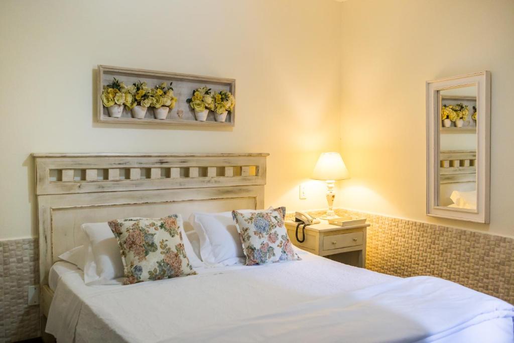 Postel nebo postele na pokoji v ubytování Pousada Villa Magnolia