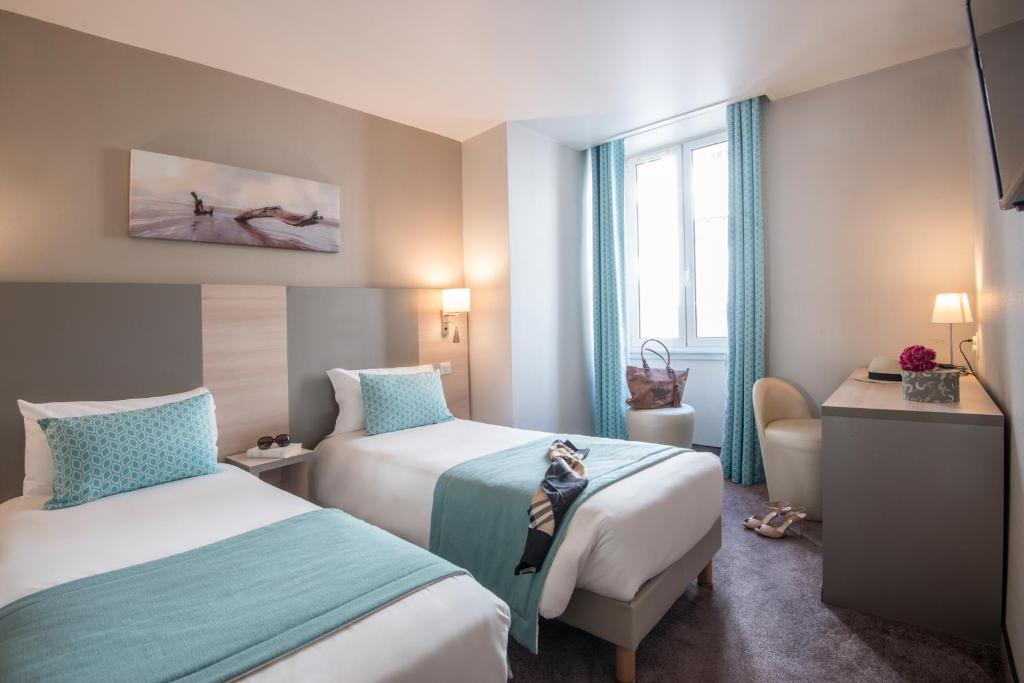 Postel nebo postele na pokoji v ubytování Hotel Du Midi