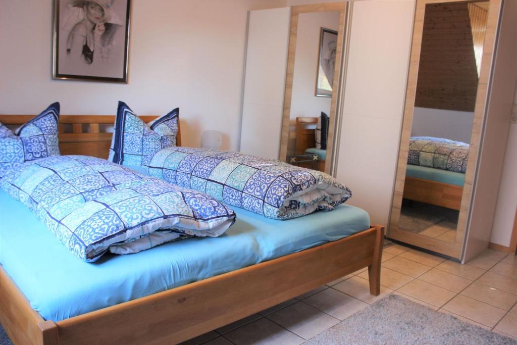 מיטה או מיטות בחדר ב-Gästehaus Thoma