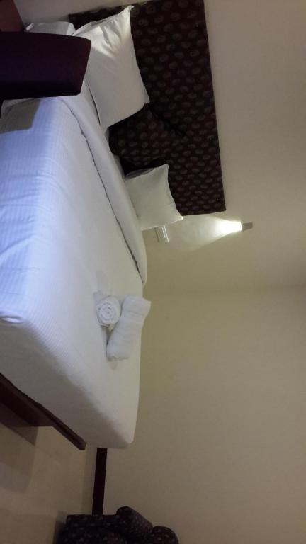 Postel nebo postele na pokoji v ubytování Olives Pleasant Stays