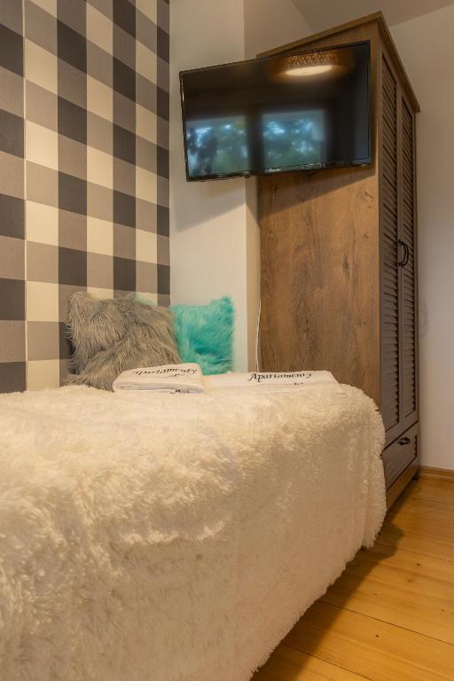Posteľ alebo postele v izbe v ubytovaní Apartament Lisowski CENTRUM