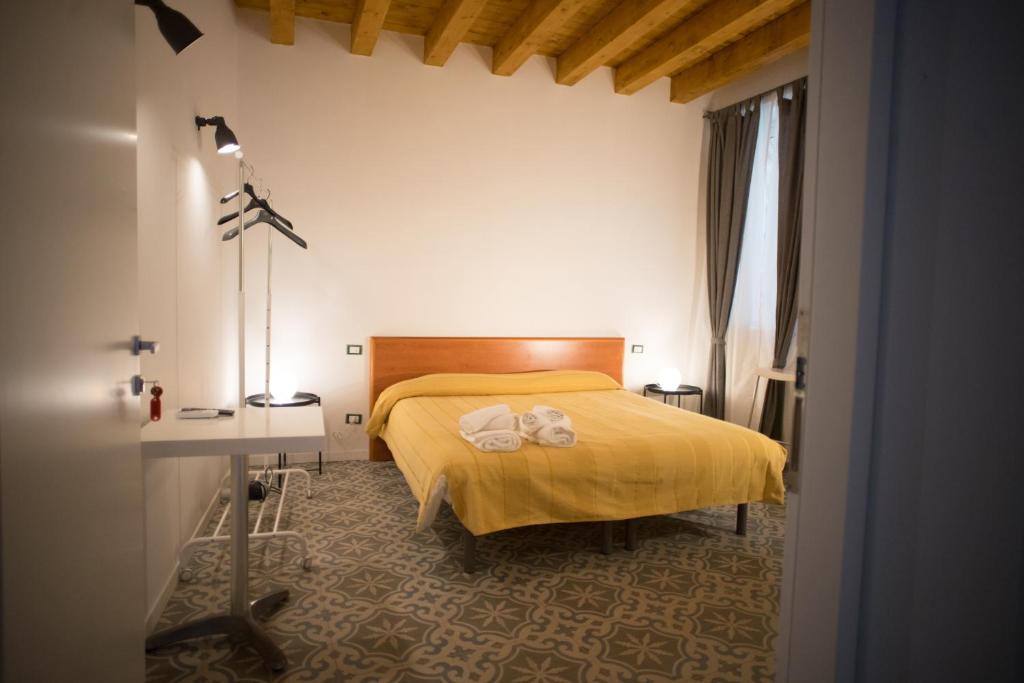 Postel nebo postele na pokoji v ubytování B&B Kolymbetra