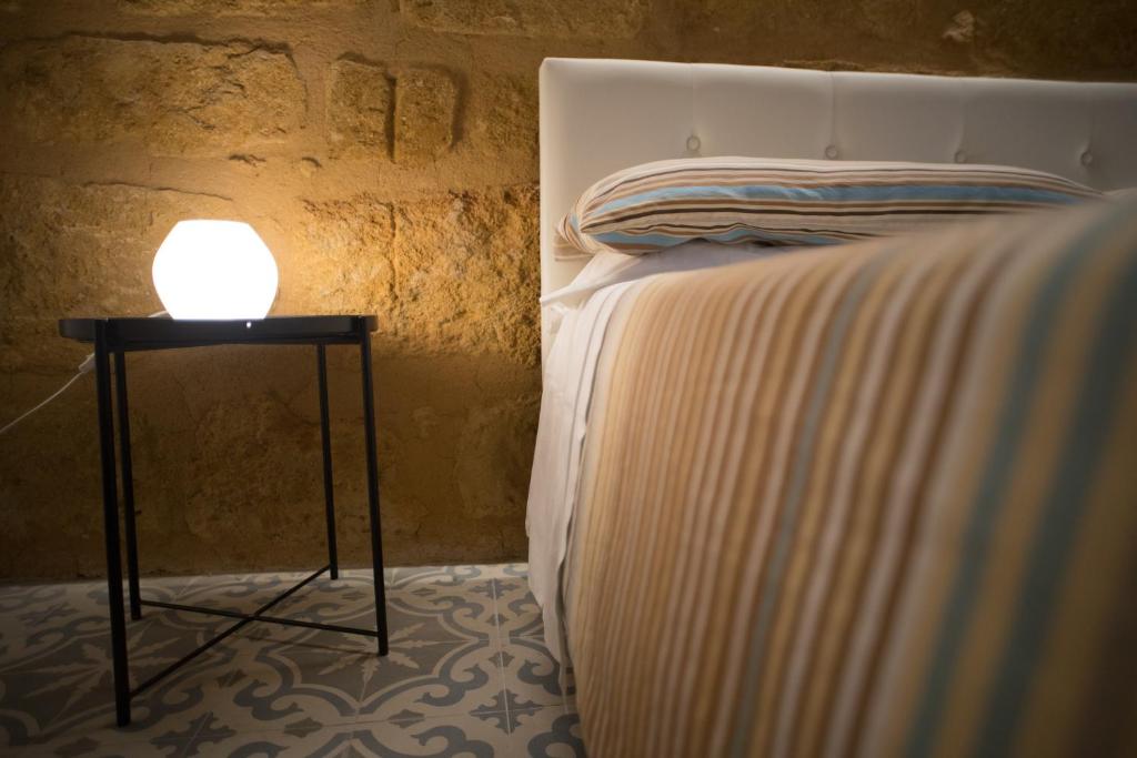 Postel nebo postele na pokoji v ubytování B&B Kolymbetra
