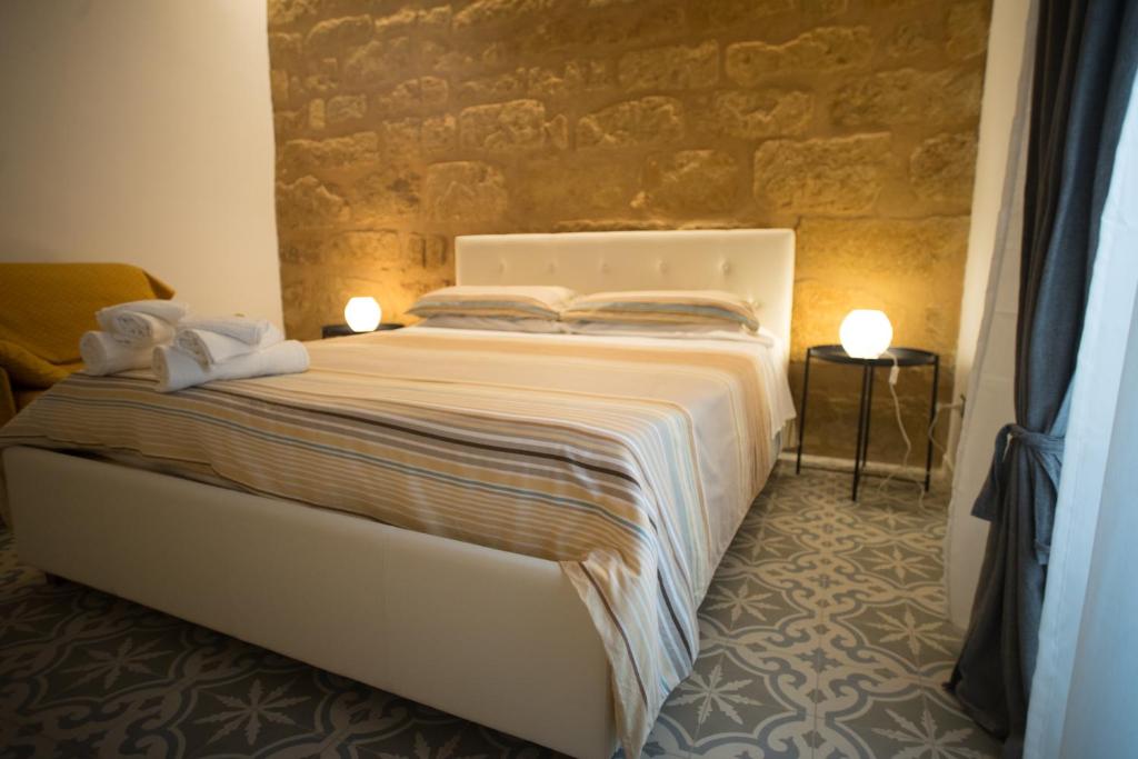 Postel nebo postele na pokoji v ubytování B&B Kolymbetra