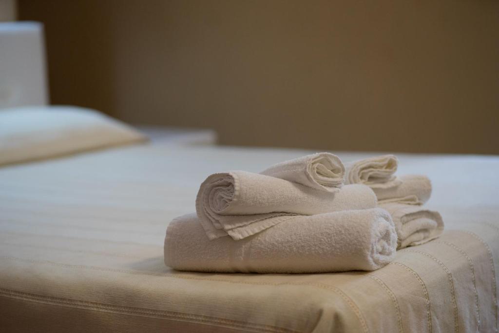 Postel nebo postele na pokoji v ubytování B&B Kolymbetra