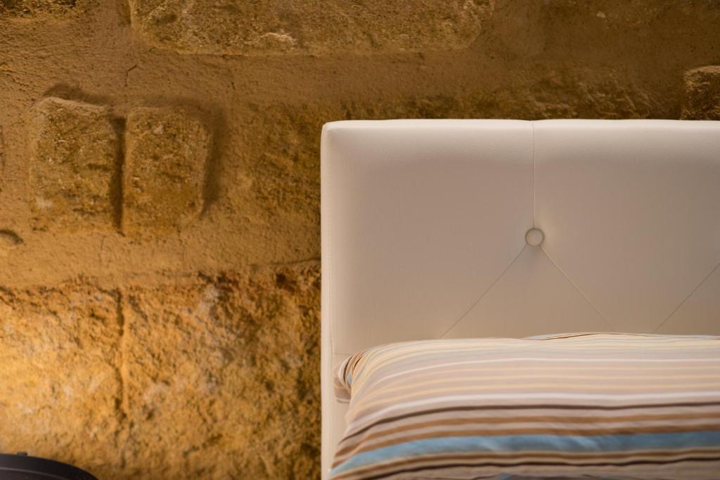 Postel nebo postele na pokoji v ubytování B&B Kolymbetra