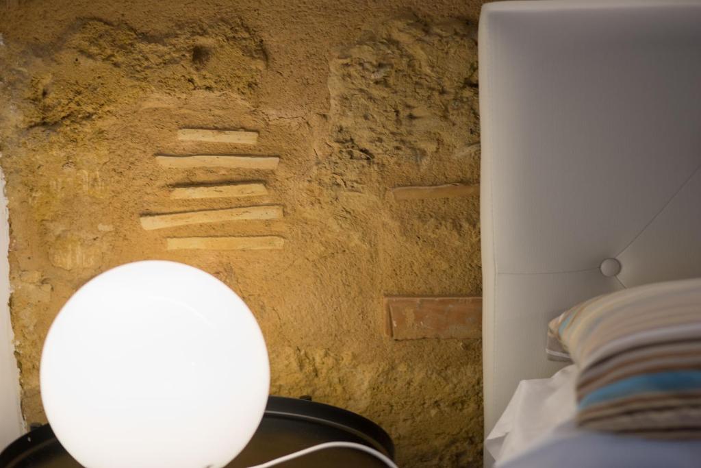 Postel nebo postele na pokoji v ubytování B&B Kolymbetra