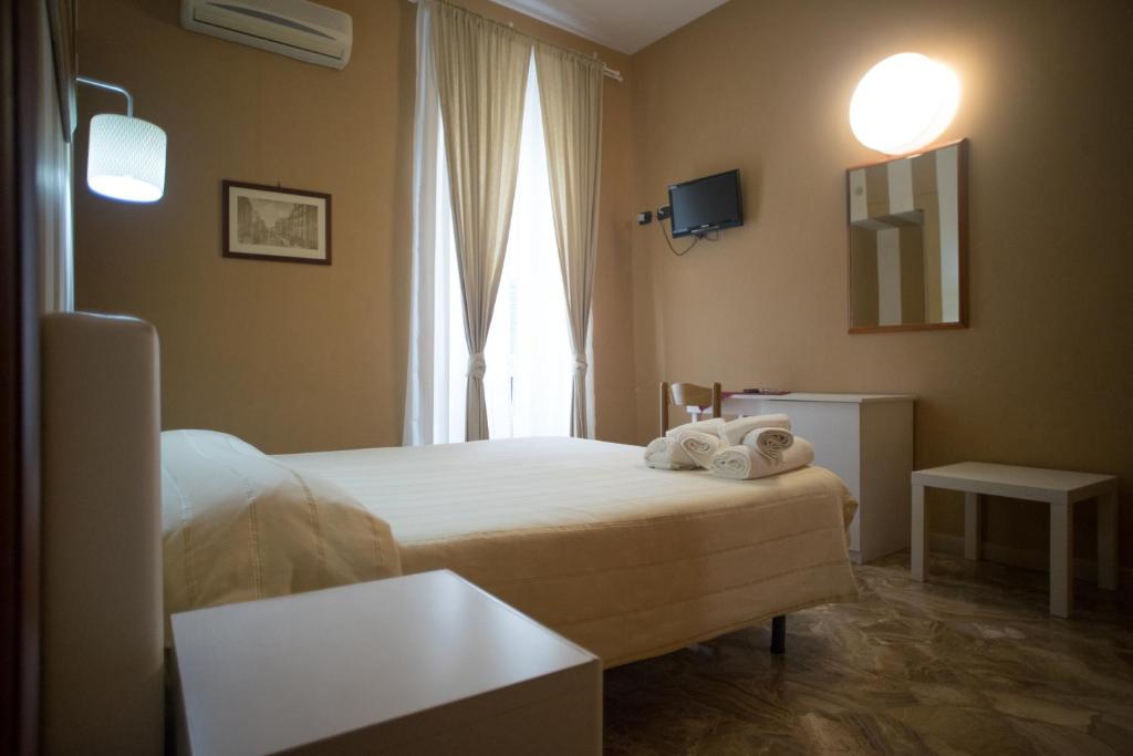 Postel nebo postele na pokoji v ubytování B&B Kolymbetra