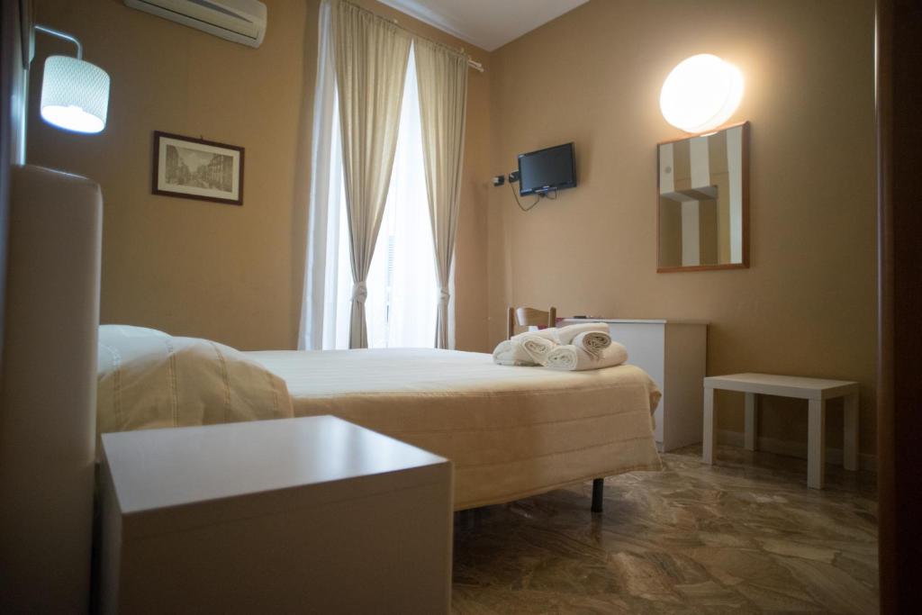Postel nebo postele na pokoji v ubytování B&B Kolymbetra