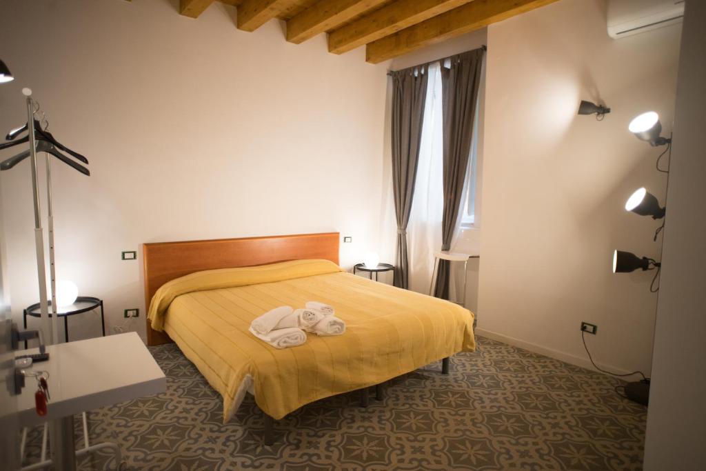 Postel nebo postele na pokoji v ubytování B&B Kolymbetra