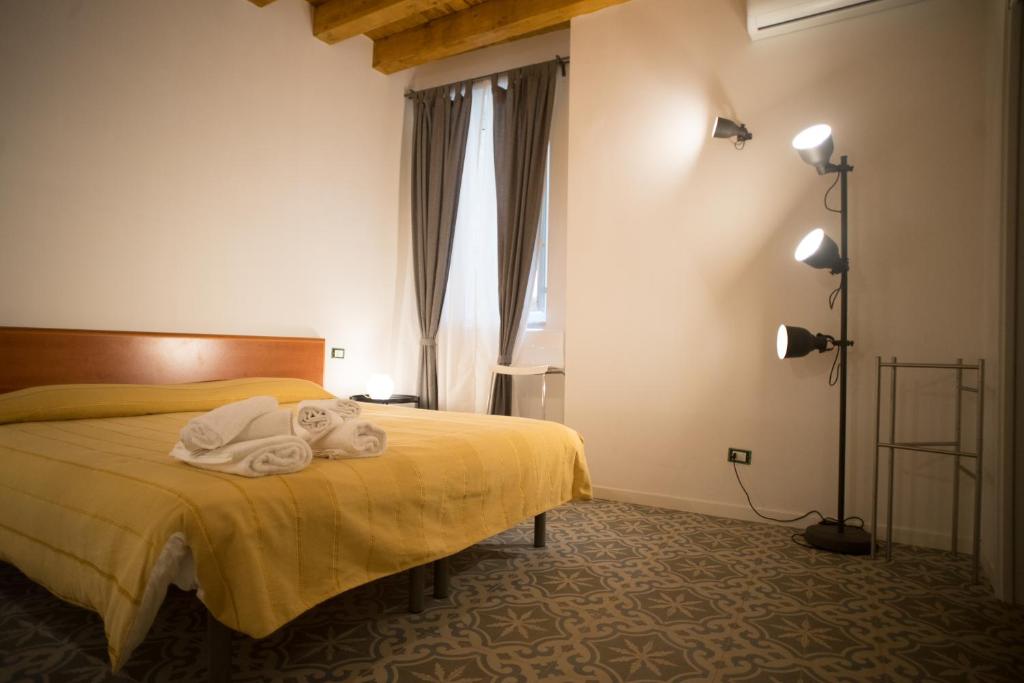 Postel nebo postele na pokoji v ubytování B&B Kolymbetra