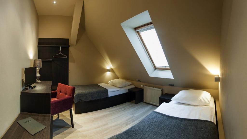 Postel nebo postele na pokoji v ubytování Hotel Rango