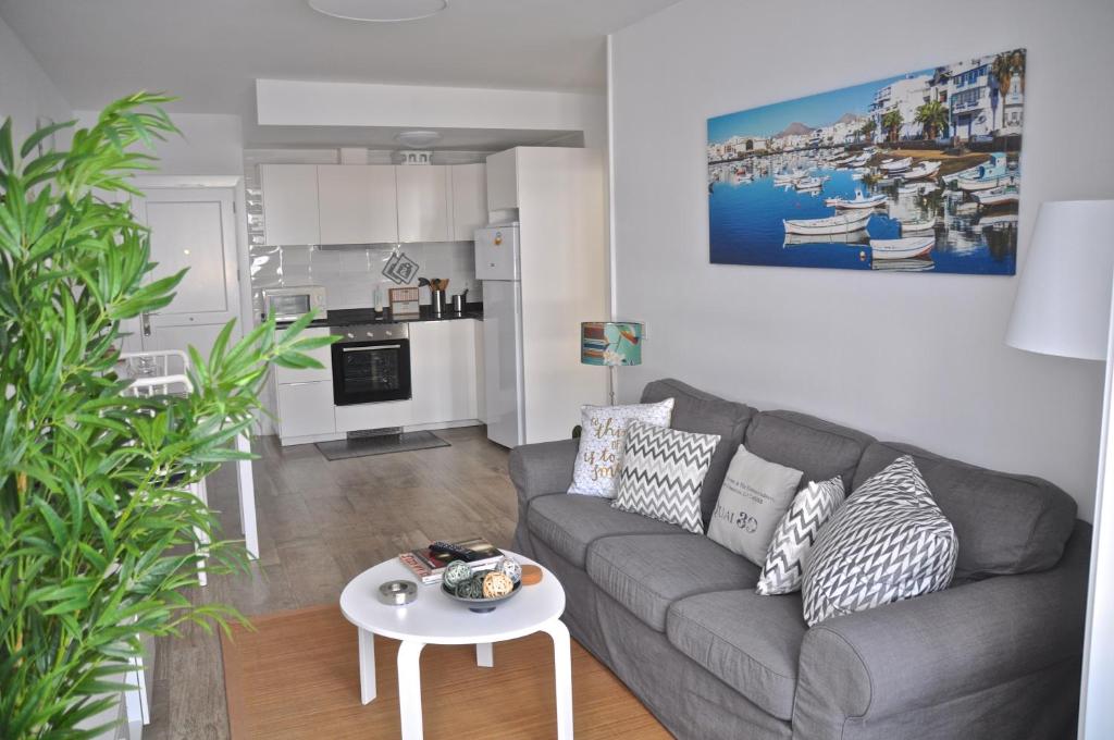 a living room with a couch and a table at Casa Tere in Arrecife