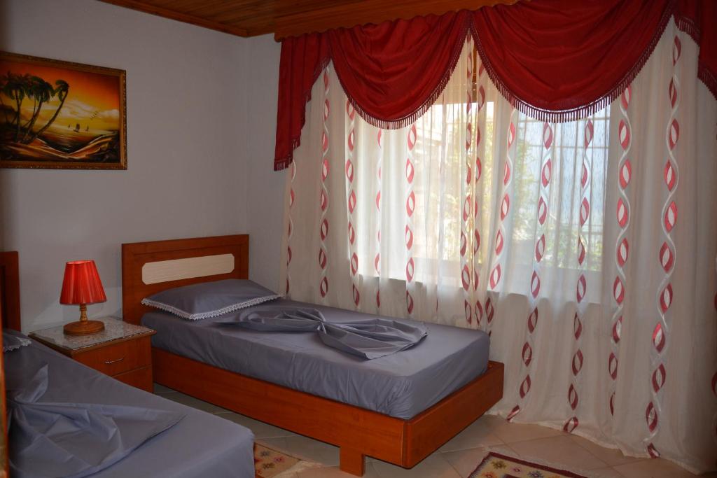 Posteľ alebo postele v izbe v ubytovaní Guest House Bake