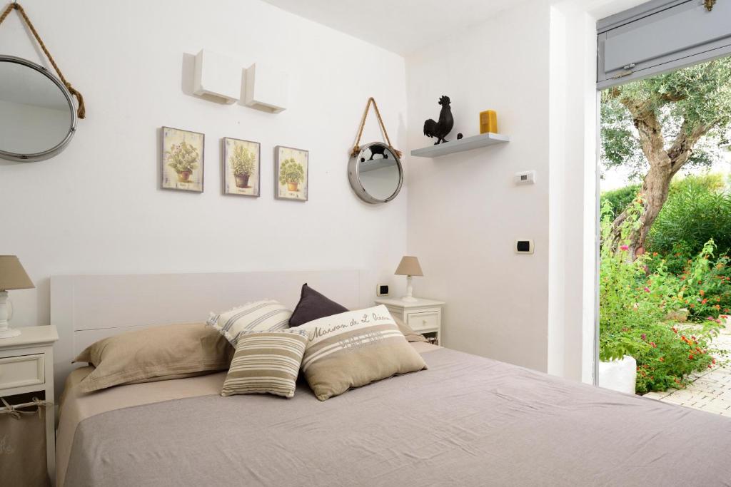 Postel nebo postele na pokoji v ubytování B&B Trullo Barbagiullo