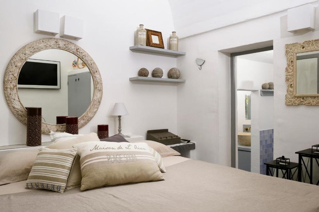 Postel nebo postele na pokoji v ubytování B&B Trullo Barbagiullo