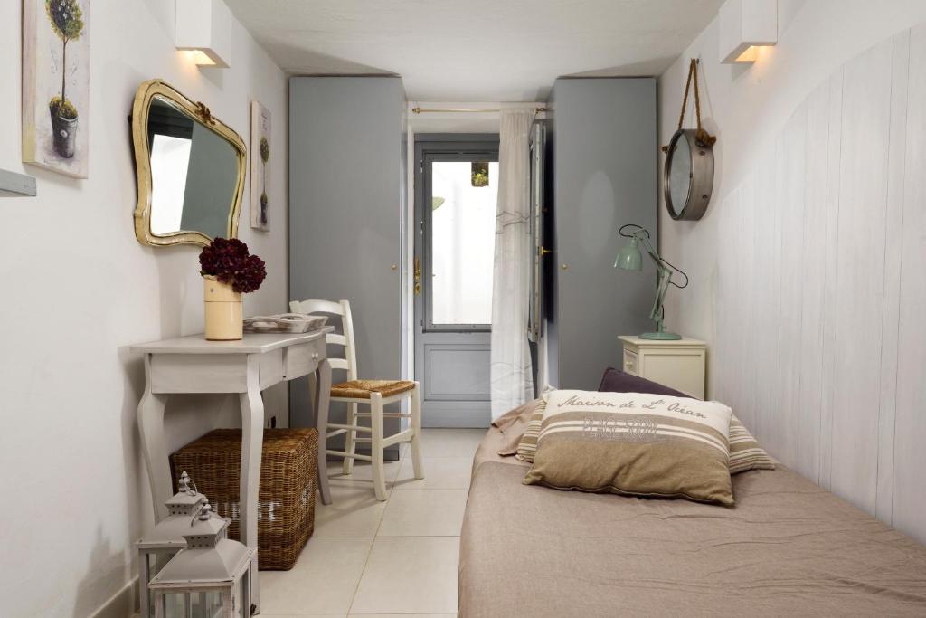 Postel nebo postele na pokoji v ubytování B&B Trullo Barbagiullo