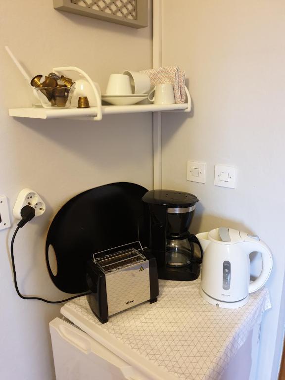 Příslušenství pro přípravu čaje a kávy v ubytování Room BM