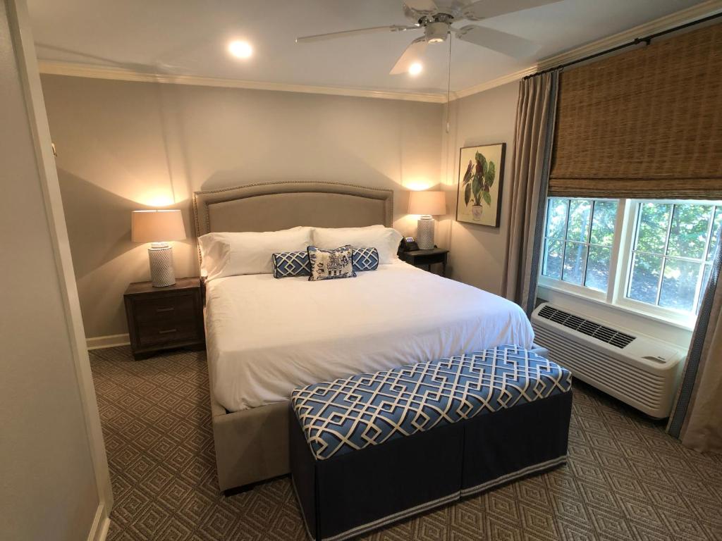 a bedroom with a large bed and a window at St. Francisville Inn in Saint Francisville