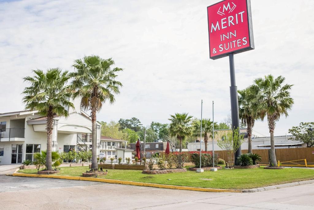 a sign for a marriott inn and suites at Merit Inn and Suites in Beaumont