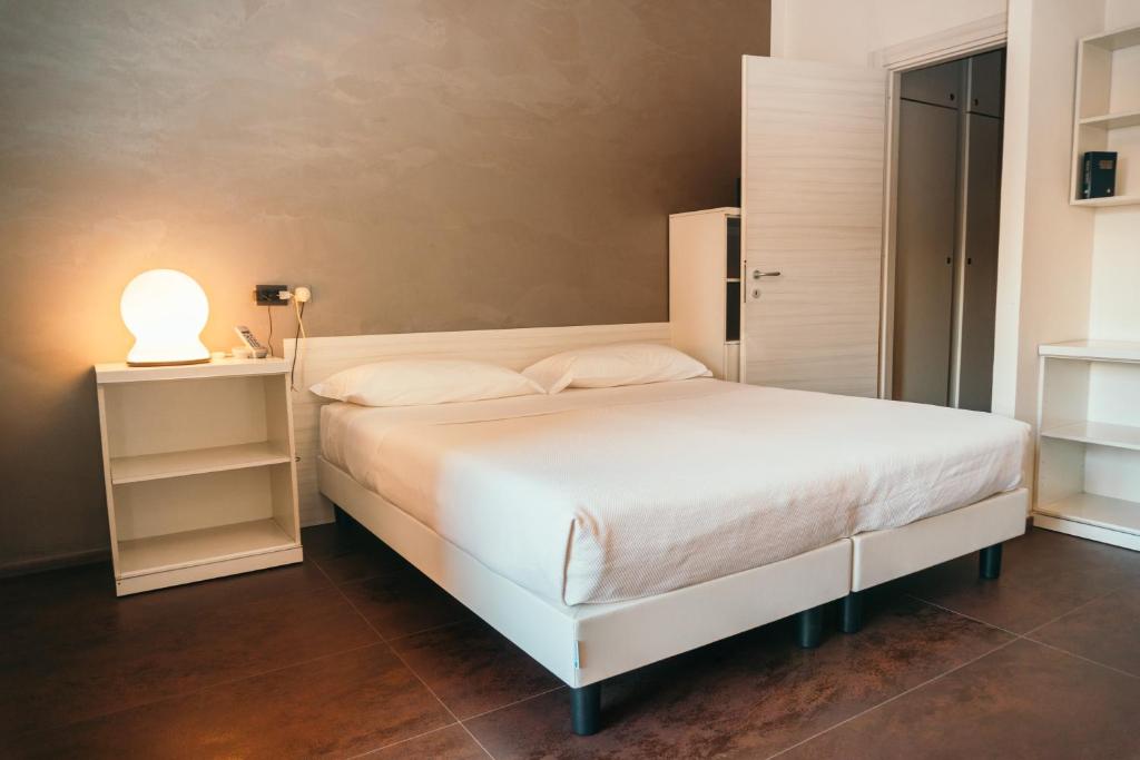 Postel nebo postele na pokoji v ubytování Residence Hotel Torino Uno