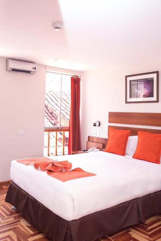Postel nebo postele na pokoji v ubytování Hotel Arcangel