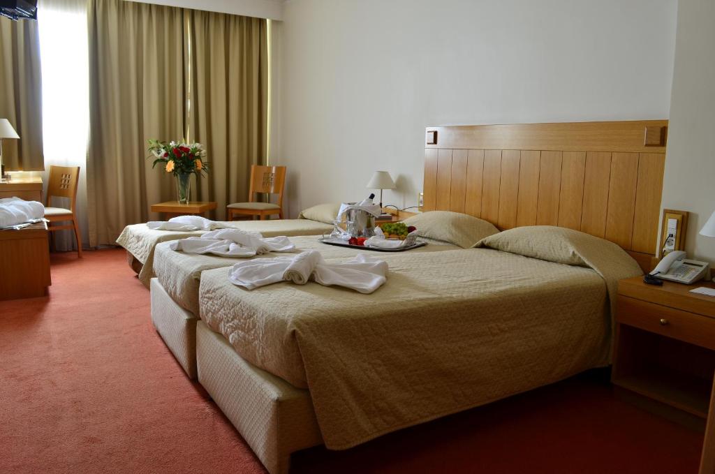 Кровать или кровати в номере Ilissos