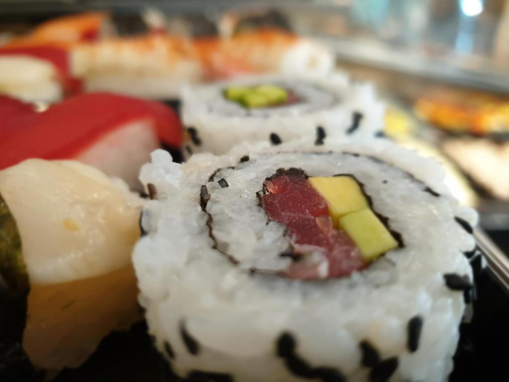 a group of sushi rolls sitting on a table at Casa Mafalda in Chioggia