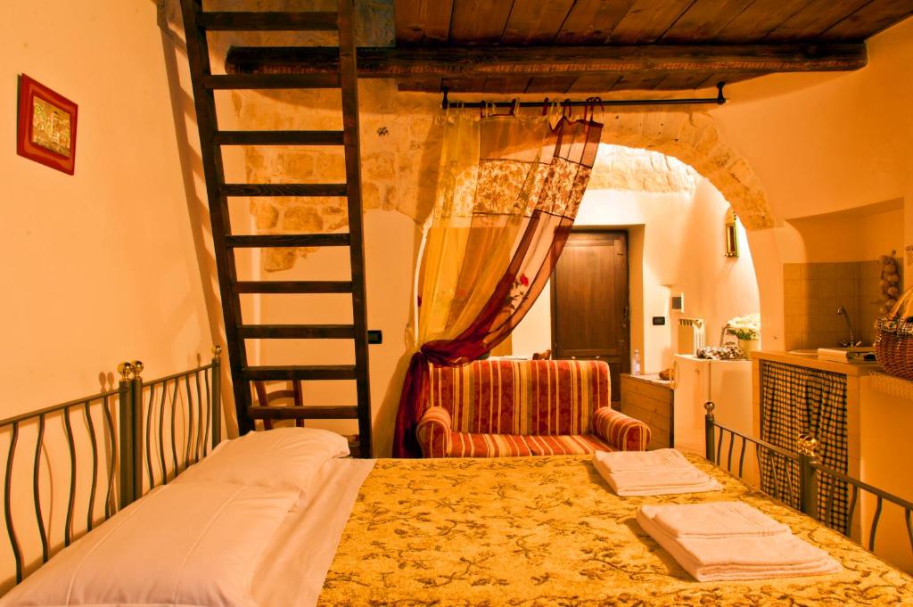 Katil atau katil-katil dalam bilik di Giardino Dei Trulli