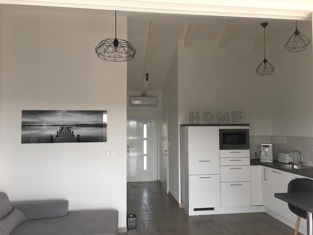 Kuchyň nebo kuchyňský kout v ubytování Ada Vis Apartments