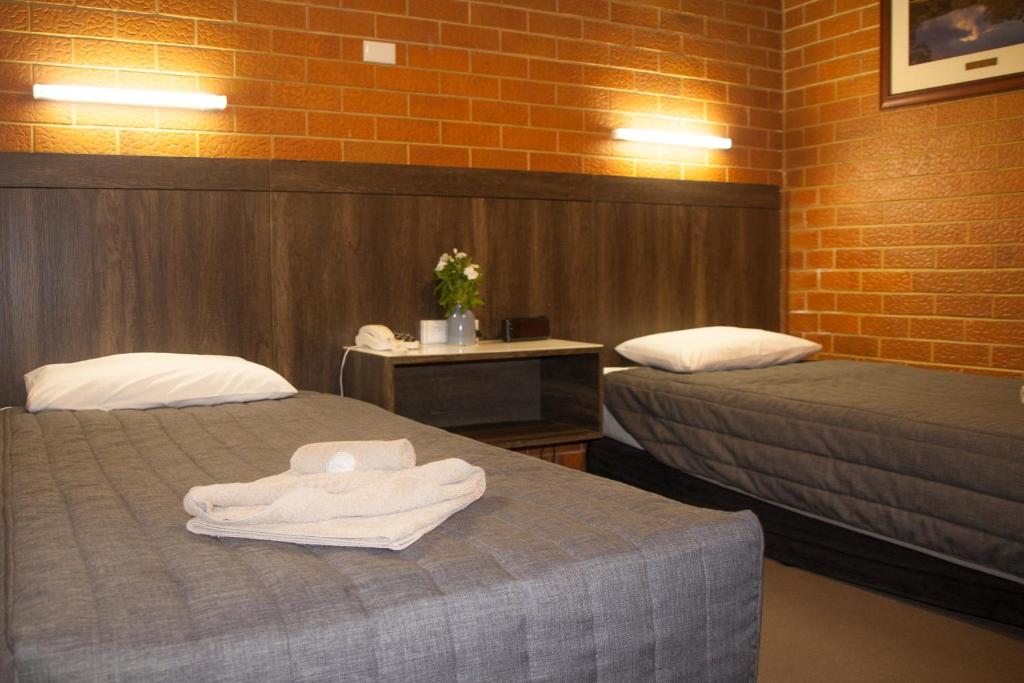 Postel nebo postele na pokoji v ubytování Angaston Vineyards Motel