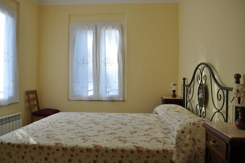 Postel nebo postele na pokoji v ubytování Agriturismo MonteMaggio