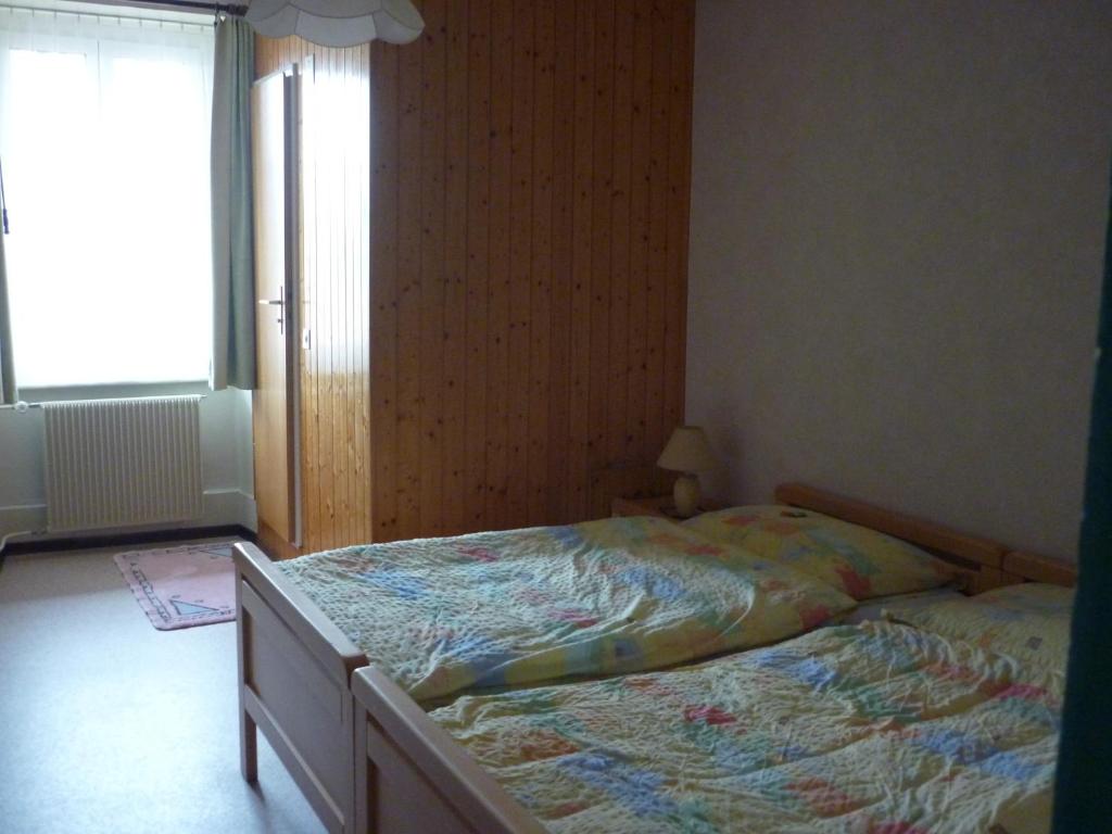 Postel nebo postele na pokoji v ubytování La Caquerelle