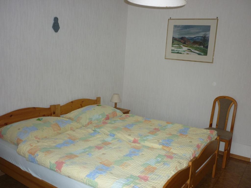 Postel nebo postele na pokoji v ubytování La Caquerelle