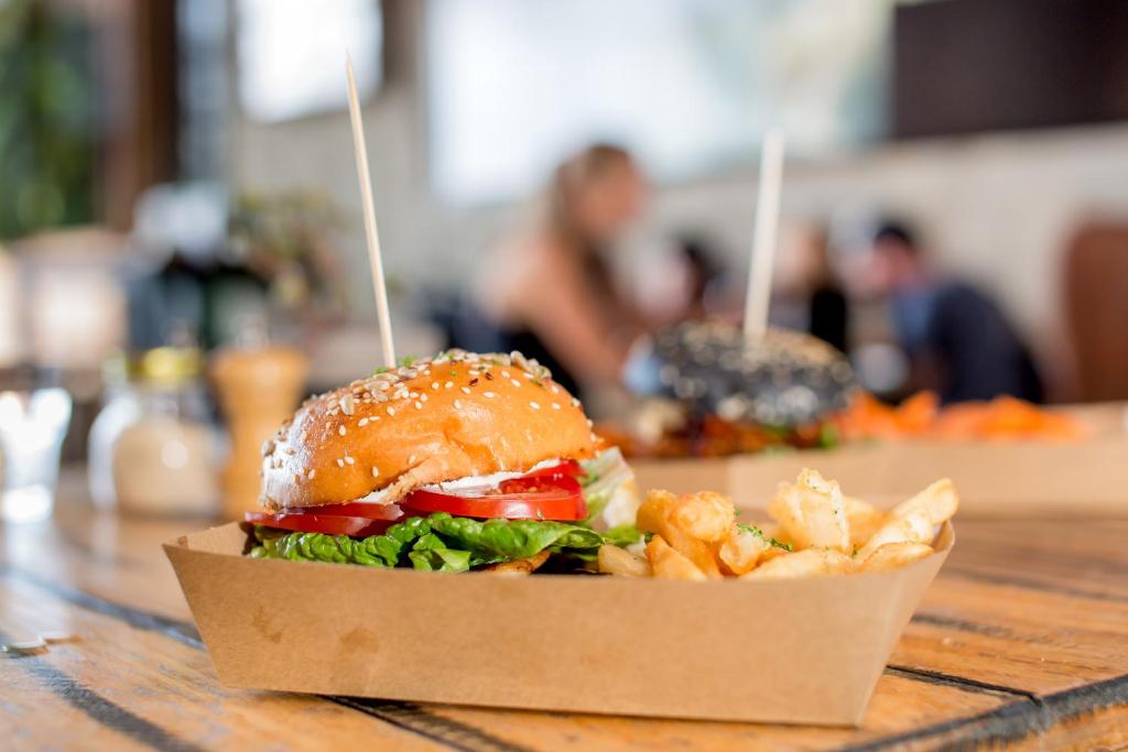 a sandwich and french fries on a table at Ingenia Holidays Torquay Australia in Torquay