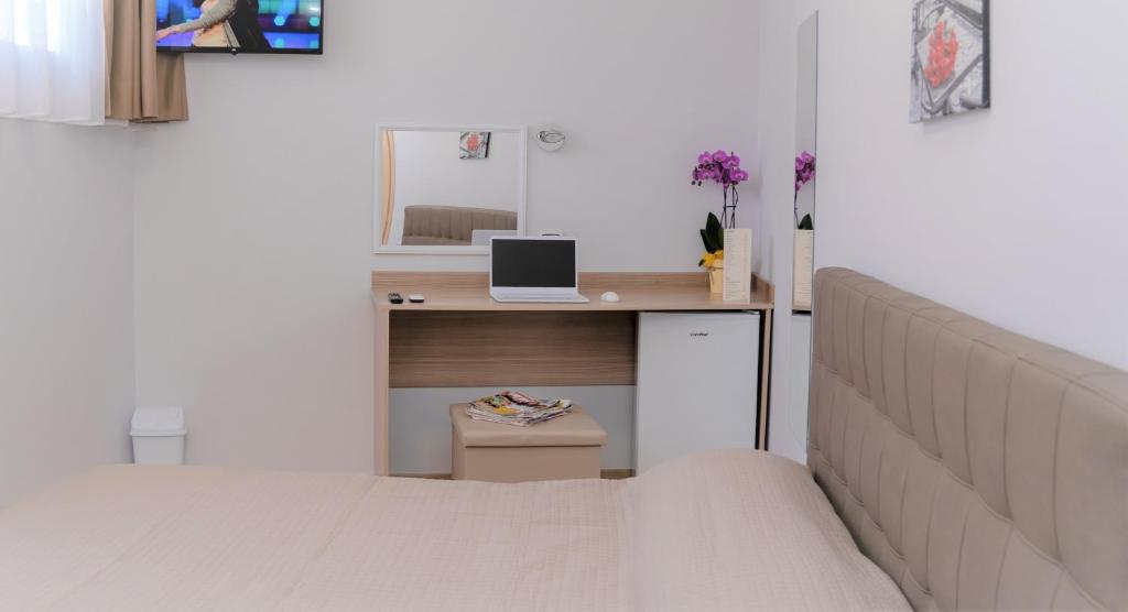TV a/nebo společenská místnost v ubytování Atico Hotel