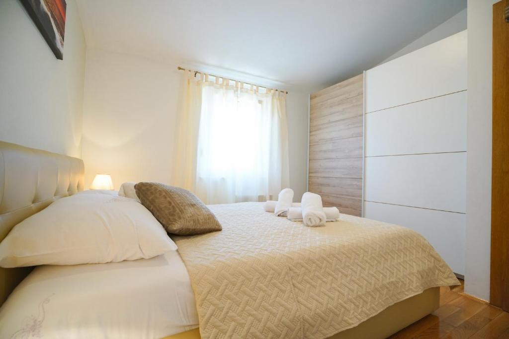 Posteľ alebo postele v izbe v ubytovaní Apartment Nicol