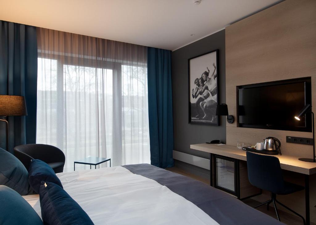 Postel nebo postele na pokoji v ubytování Kalev Spa Hotel & Waterpark