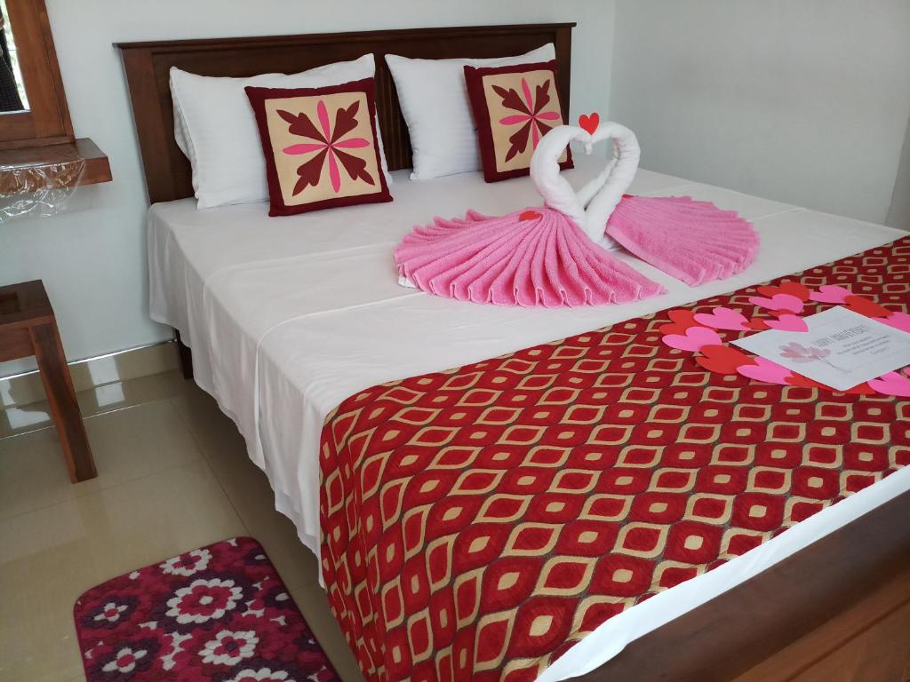 Postel nebo postele na pokoji v ubytování Shani Residence Kandy
