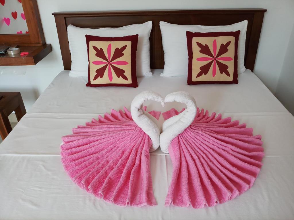Postel nebo postele na pokoji v ubytování Shani Residence Kandy
