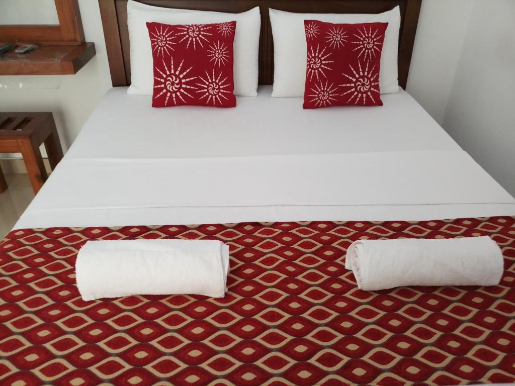 Postel nebo postele na pokoji v ubytování Shani Residence Kandy